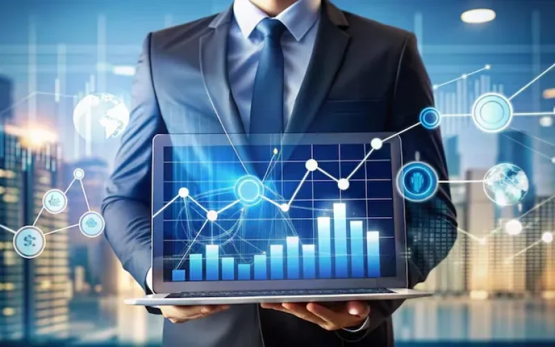 imgi_4_businessman-holding-laptop-showing-financial-data_9975-22146