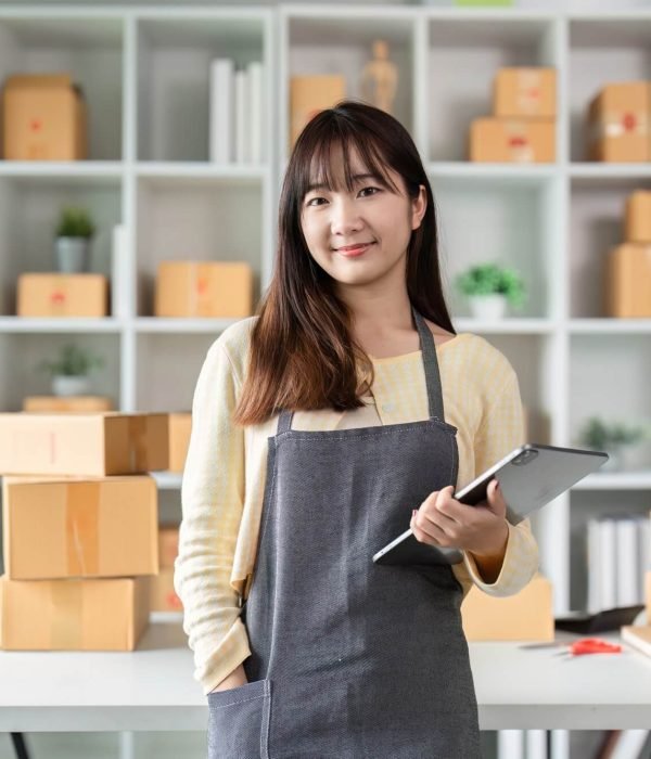 portrait-of-a-young-woman-entrepreneur-in-her-home-office-with-shipping-boxes-and-digital-tablet.jpg